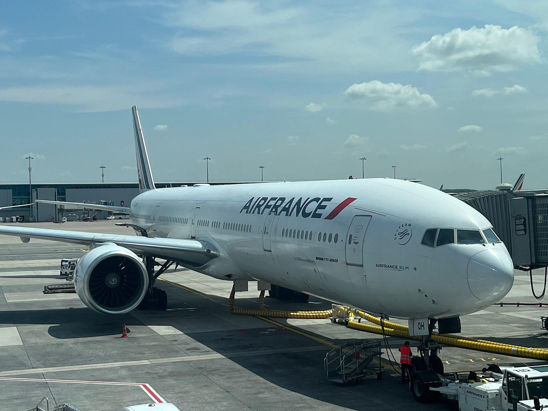 Air France Boeing 777-300ER parked at a jet bridge at Paris-Charles de Gaulle Airport