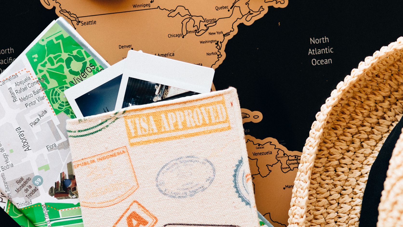 Passport and compass on top of travel maps